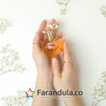 Concept of female perfume on white background