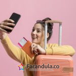 happy-woman-taking-selfie-with-her-passport-baggage